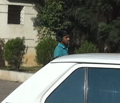 Pune India men wearing earmuffs