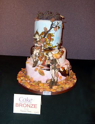 A 3 tiered autumn theme wedding cake that has won me a Bronze Award in Cake