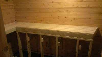 Sauna benches and supports installed.