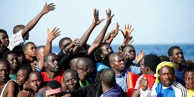  Migrants are seen during the rescue operation in the Mediterranea Sea October 20, 2016. Yara Nardi/Italian Red Cross press office/Handout via Reuters (This image was provided by a third-party. Editorial Use Only)