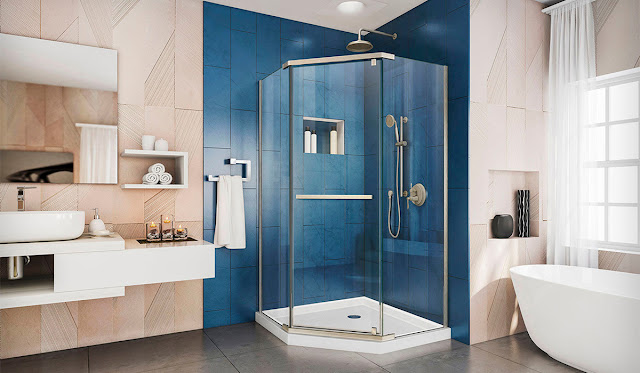 Corner shower with bright blue statement tiles.