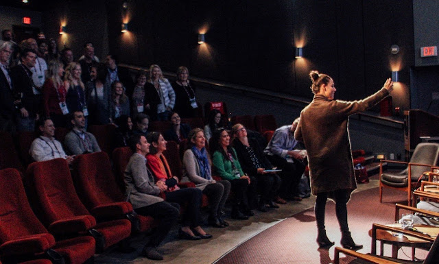 "The Magicians" actress Jade Tailor takes a #PledgePaperless selfie with attendees of the Sustainable Production Forum at the Vancouver International Film Festival