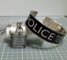 TARDIS door sign pendant and POLICE BOX sign bracelet.