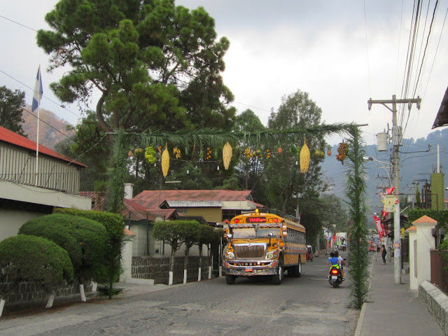 arch and chicken bus at Easter in Panajachel