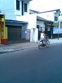 Old man bicycling in the morning