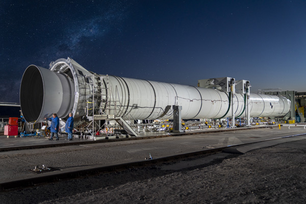 The flight support booster for future variants of the Space Launch System's solid rocket boosters is installed onto a test stand at Northrop Grumman's facility in Promontory, Utah.