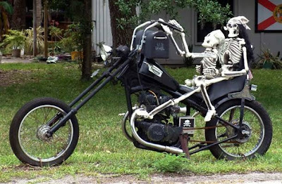 Two Skeletons Riding a Motorycle Mailbox