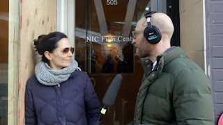 Josh Bloch interviews Sarah Edmondson in front of the former site of Vancouver's Executive Success Programs (ESP) centre in February 2018. (Kathleen Goldhar/CBC)