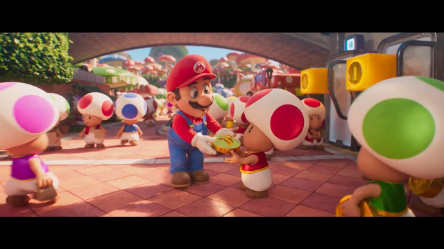 Imagem de Super Mario Bros.: O Filme em que Mario entrega uma moeda a um Toad em uma cidade cheia de Toads.