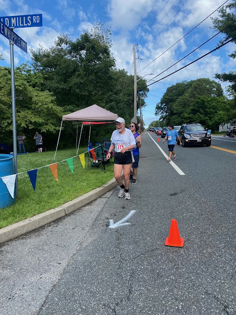 The author heads to the finish line at the 2021 Arnold Mills Fourth of July race.