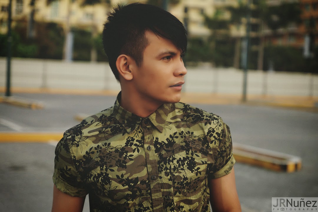 Bibo Bayona wearing camouflage shirt