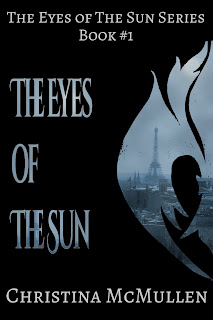2015 version of The Eyes of The Sun cover. This one has a large fleur de lis cut in half to the right with the same picture of paris imposed inside it with the title to the left