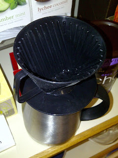 Coffee dripper on top of a coffee cup