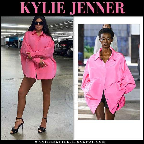 Kylie Jenner in pink oversized shirt and black sandals