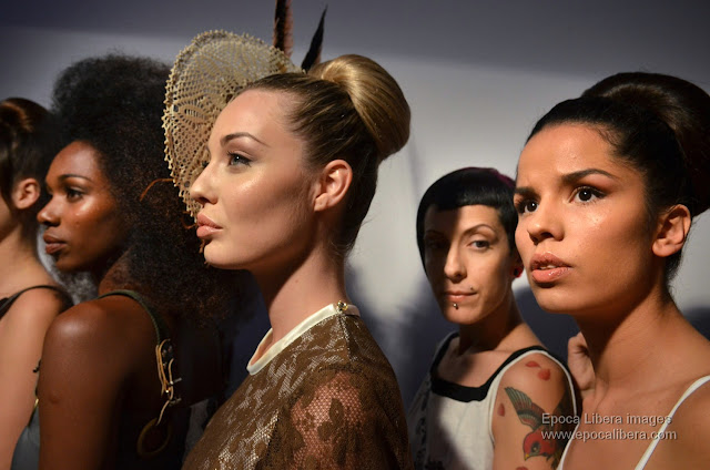 Models in a row before the exit to the catwalk for the Panos Apergis collection.