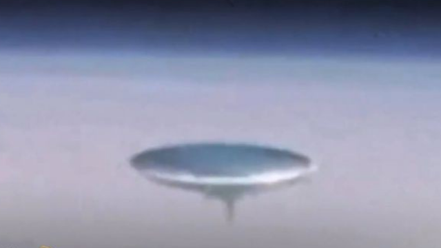 This is a great closer look at the metal disk UFO near the ISS.