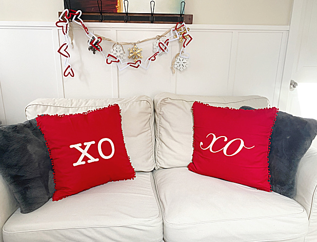 valentine pillows on white sofa