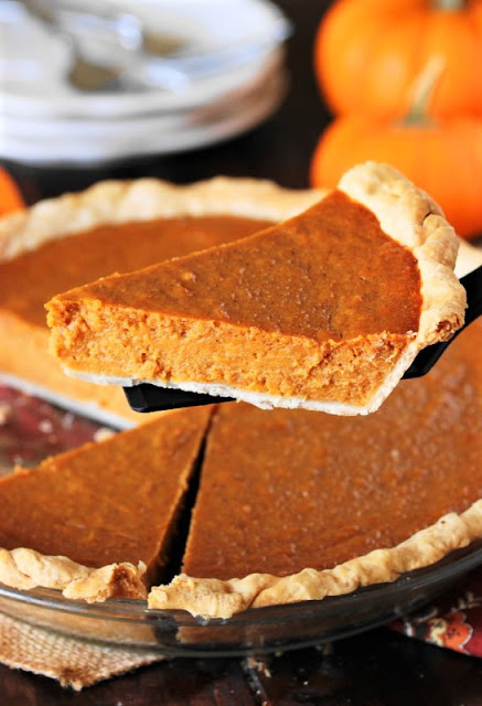 Serving a Slice of Sweet Potato Pumpkin Pie Image