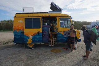 We talk with people from a flashy yellow painted van