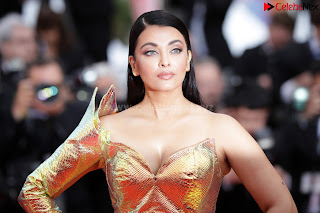 Aishwarya Rai in a Shoulder less Sleeveless Deep neck Golden Gown at A Hidden Life Screening Cannes .xyz Exclusive Pics 05.jpg