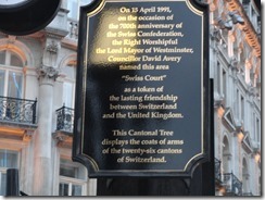 Swiss Court token of friendship to UKCantonal Tree was erected in 1991 as part of the 700th anniversary of the Swiss Confederation as a token of friendship between Switzerland and the United Kingdom. The tree bears the arms of the twenty six cantons.