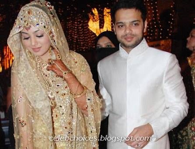 The marriage had a white theme with white curtains lamps mandap and stage