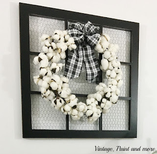 Vintage, Paint and more... a gorgeous farmhouse cotton boll wreath made with a cotton garland and black and white check fabric bow on a wonderful screened window frame.