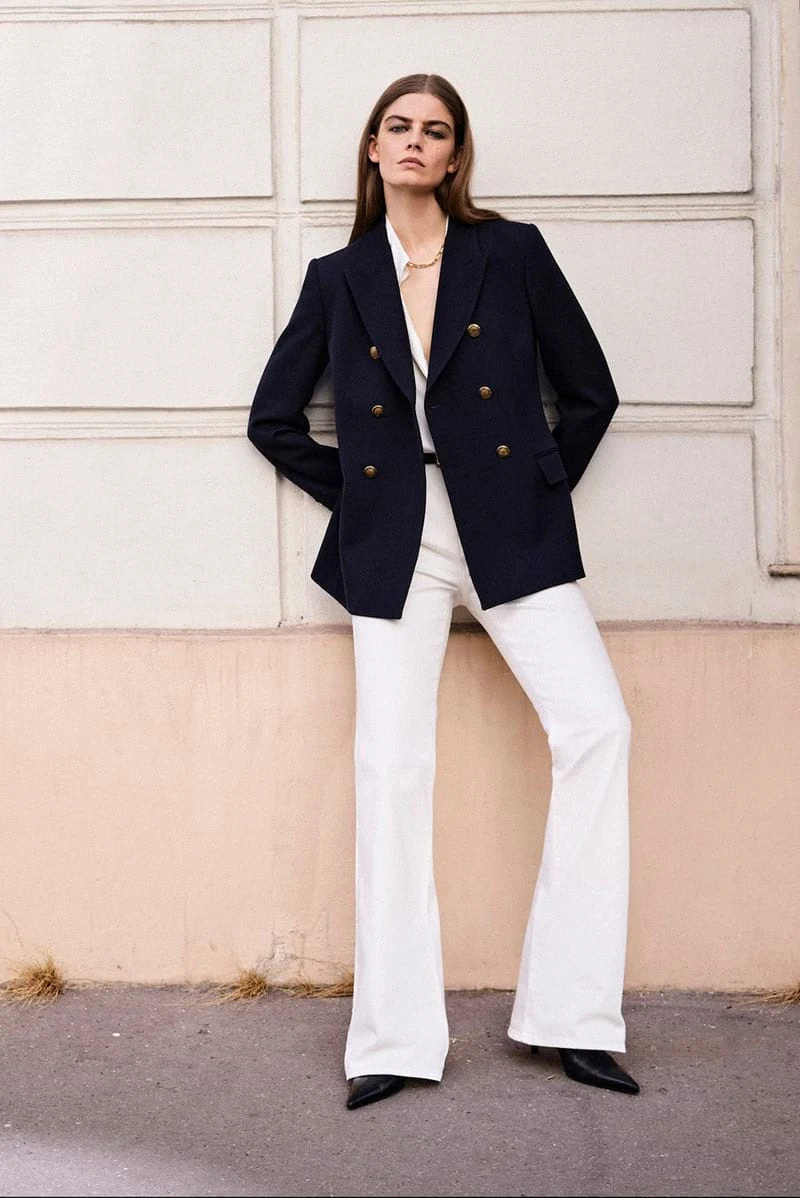 Merlijne Schorren poses in high-waist wide-leg jeans from Massimo Dutti