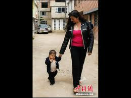 Edward Nino Hernandez walks with his mother Nohemi outside their home in Bogota September 6.