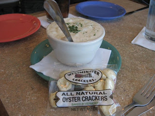 Click to enlarge - Clam chowder with a bag of oyster crackers.