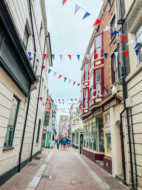 side street in weymouth with bunting