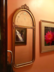 image of an antique bathroom mirror in a bathroom with 'sun kissed apricot' painted walls