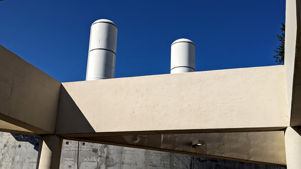 Space shuttle Endeavour's twin solid rocket motors stand tall at the construction site for the California Science Center's Samuel Oschin Air and Space Center in Los Angeles...on November 8, 2023.