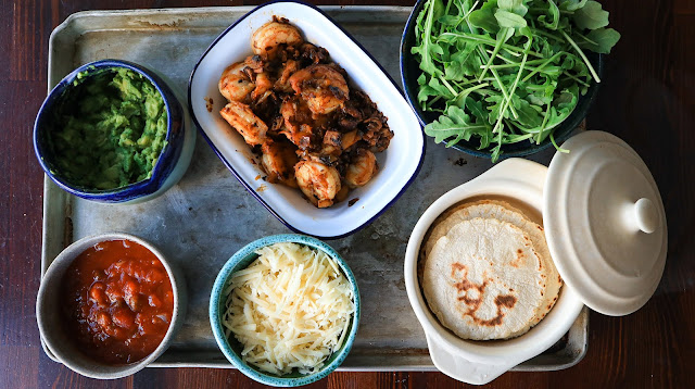 Ingredients for Paprika-Garlic Shrimp Tacos on a metal sheet pan