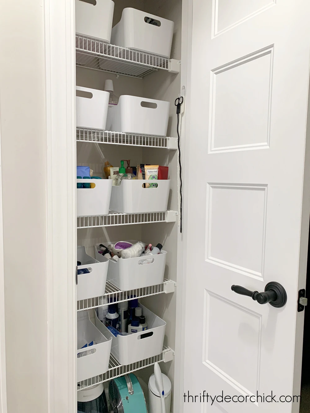 white plastic bins linen closet