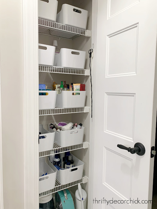 white plastic bins linen closet