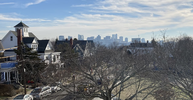 The Boston skyline is visible from the monument of the tower at Prospect Hill Park in Somerville Massachusetts
