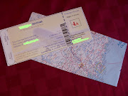 We made it look like a plane ticket and the envelopes are made from maps. (img )