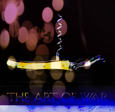 Art of War and wine opener picture.