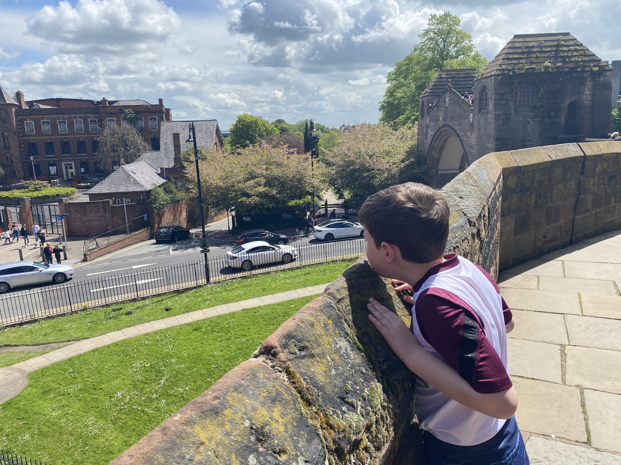 boy overlooking a wall