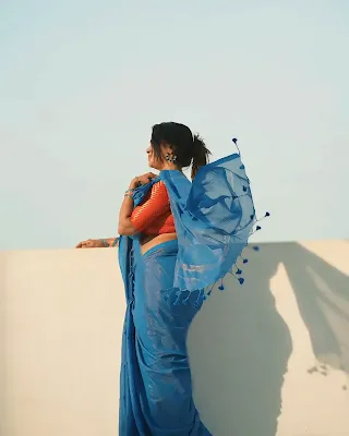 Subha Geetha looking elegant in a blue saree during a stunning photoshoot
