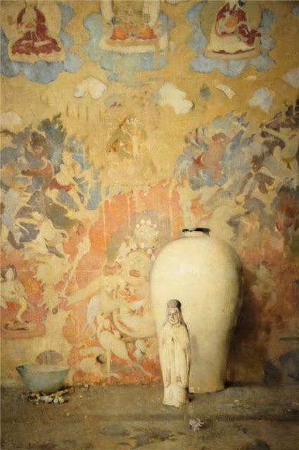 Magnificent colorful still life painting with saint statue and colorful wall by Emil Carlsen Soren