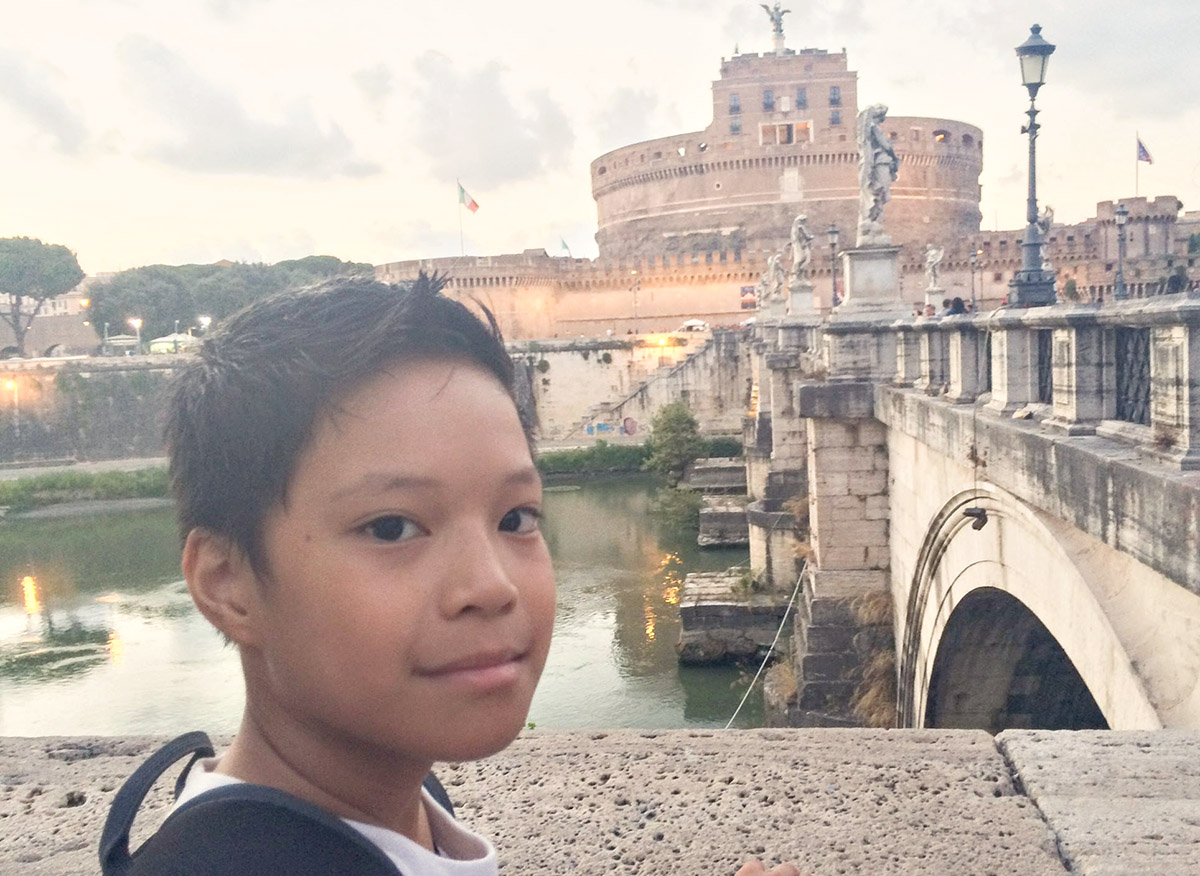 Exploring Rome With Kids : Best Things To See and Do, kid with Castel Sant'Angelo in the bacground