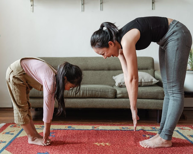 Mother and daughter exercising