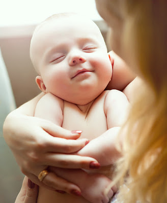 Cute Little Baby in Mothers hands