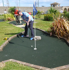 Photo of Richard Gottfried playing the 18th hole at Splash Point Mini Golf course in Worthing