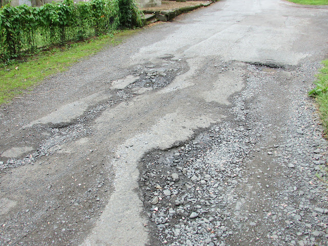 Bad roads, potholes, India,