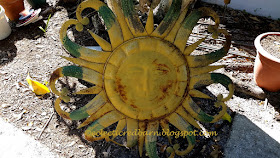 Eclectic Red Barn: Discarded metal sun