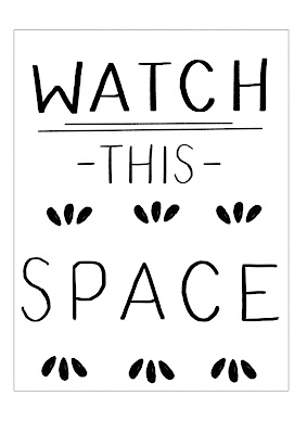 Watch this space in black hand-lettering on a white background.