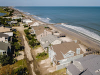 Homes on Pawleys Island, S.C., some damaged in the aftermath of Hurricane Dorian last month. (Credit: Johnny Milano for The New York Times) Click to Enlarge.